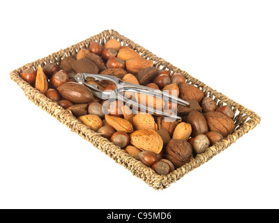 Wicker Basket Or Tray Of Whole Mixed Healthy Nuts With Their Shells On Against A White Background With A Clipping Path And No People Stock Photo