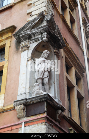 Statue on house at Rue Saint-Jean on Old Town in Lyon city, France Stock Photo