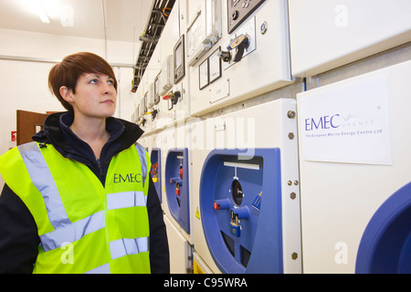 An electrician at EMEC's substation for wave and tidal energy power, Orkney, Scotland, UK. Stock Photo