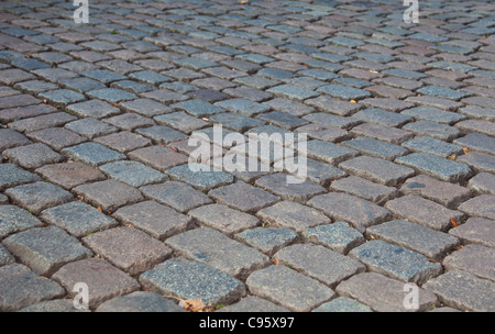 Grey cobbled pavement, background texture. Stock Photo