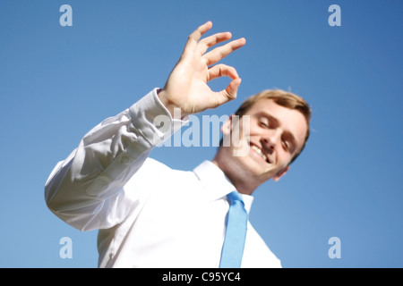 A business man displaying OK signs Stock Photo