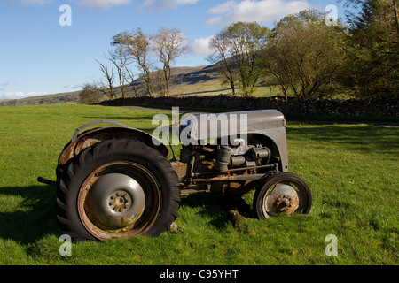 Disused Old Grey Ferguson Tractor on Farm, near Ingleton, Yorkshire, Dales Landscape, UK Stock Photo