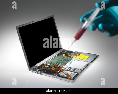 Computer virus. Conceptual image of a laptop being infected with a virus. Stock Photo