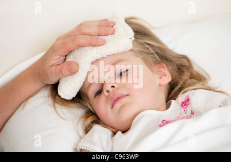 Soothing a child's fever. Stock Photo