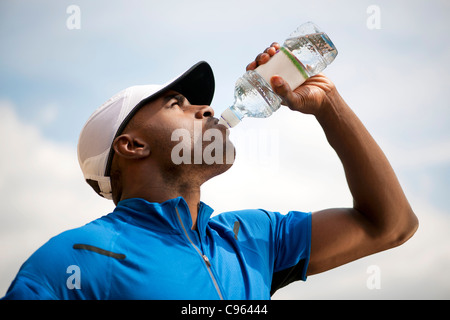 Man drinking bottled water. Stock Photo