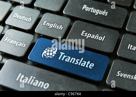 Multilingual translation online concept. Close up of multi language keyboard and translate word key in blue color with clippingpath. Stock Photo