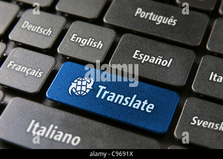 Multilingual translation online concept. Close up of multi language keyboard and translate word key in blue color with clippingpath. Stock Photo