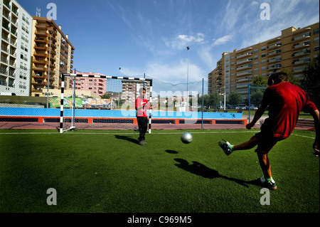 Two boys playing street football Stock Photo