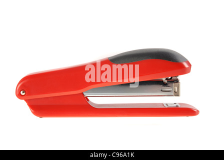 A red and black stapler isolated on white background. Included clipping path, so you can easily cut it out and place over the top of a design. Stock Photo