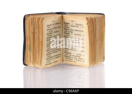 Mini Spanish dictionary focused on success word with its reflection on white background. Included clipping path, so you can easily cut it out and place over the top of a design. Stock Photo