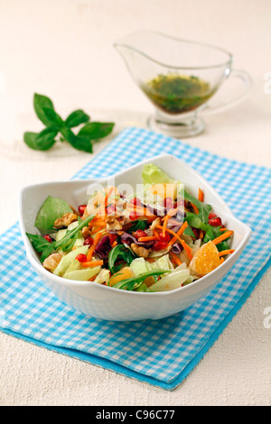 Salad with pomegranate and tangerines. Recipe available. Stock Photo