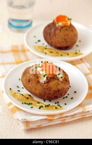 Roasted potatoes with caviar. Recipe available. Stock Photo