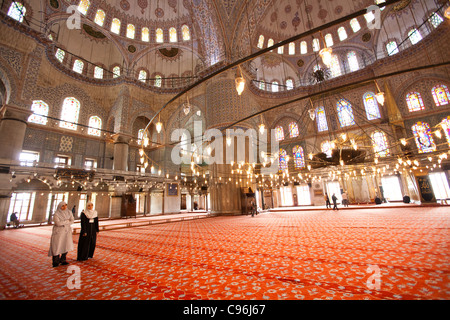 Two Muslim women in Yeni Camii - Istanbul Stock Photo