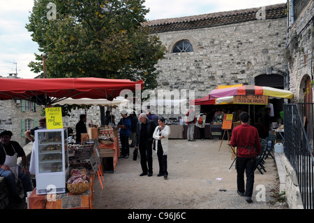 Traders and customers at the annual Fete de la Figue in the small medieval town of Vezenobres in the southof France. Stock Photo