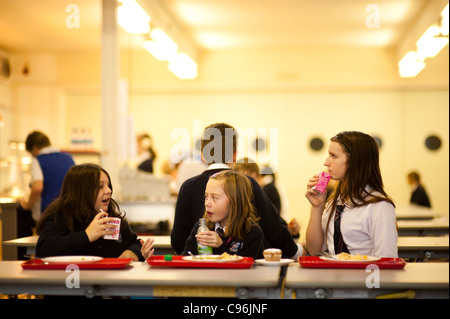 Secondary school children in the canteen having lunch, Wales UK Stock Photo