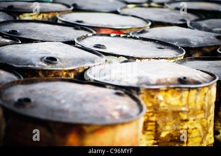 rusty oil barrels on beach Stock Photo