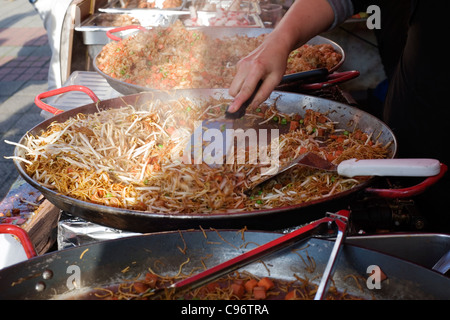 selling traditional asian food at a street market southsea england uk Stock Photo