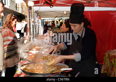 selling traditional asian food at a street market southsea england uk Stock Photo