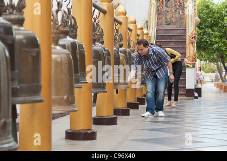 Ringing temple bells at Doi Suthep temple in Chiang Mai, Thailand Stock Photo