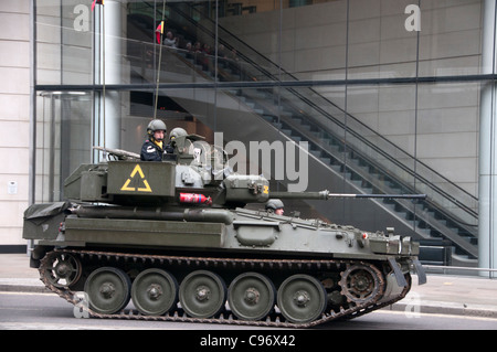 Lord Mayor's show. A tank in the procession passes through the City , and the Museum of London Stock Photo