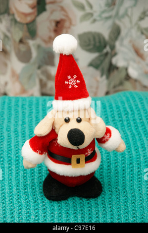 Father Christmas (Santa Clause) cuddly toy dog Stock Photo