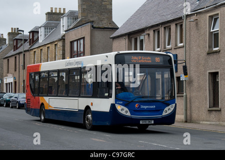 An Alexander Dennis Enviro 300 of Stagecoach passes through the streets of Thurso on its way to John O'Groats Stock Photo