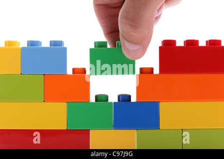 Building a wall from blocks Stock Photo