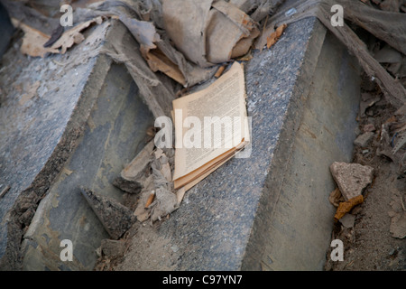 Text book on the stairs amongst the rubble Palace of Culture Energetik Lenin Square Pripyat Chernobyl exclusion zone Ukraine Stock Photo