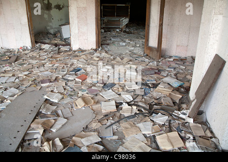 Piles of books scattered over the floor of the Palace of Culture Lenin Square, Pripyat Chernobyl exclusion zone Ukraine Stock Photo