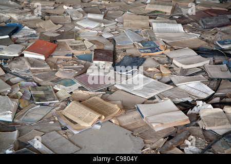 Piles of books scattered over the floor of the Palace of Culture Lenin Square, Pripyat Chernobyl exclusion zone Ukraine Stock Photo