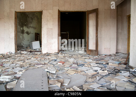 Piles of books scattered over the floor of the Palace of Culture Lenin Square, Pripyat Chernobyl exclusion zone Ukraine Stock Photo