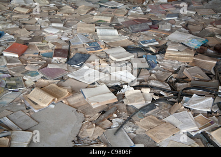 Piles of books scattered over the floor of the Palace of Culture Lenin Square, Pripyat Chernobyl exclusion zone Ukraine Stock Photo