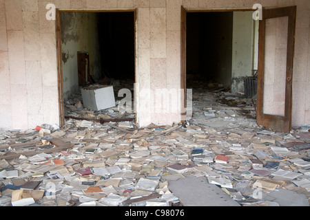 Piles of books scattered over the floor of the Palace of Culture Lenin Square, Pripyat Chernobyl exclusion zone Ukraine Stock Photo