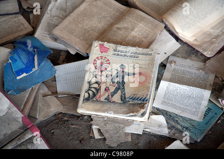 Piles of books scattered over the floor of the Palace of Culture Lenin Square, Pripyat Chernobyl exclusion zone Ukraine Stock Photo