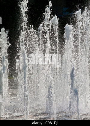 Jets of water in a fountain at Sheffield Peace Gardens in Sheffield City Centre South Yorkshire England UK Stock Photo