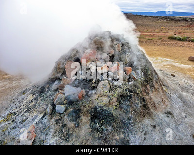 Rock pile geothermal fumarole in iceland in summer time Stock Photo