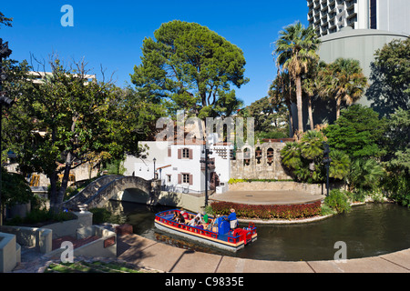 Tour boat in the Arneson River Theater on River Walk in downtown San Antonio, Texas, USA Stock Photo