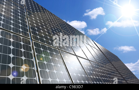 Solar panel under blue sky brightly lit by the sun Stock Photo