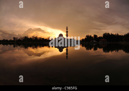 Masjid Tengku Tengah Zaharah or also known as Floating Mosque in Kuala Terengganu, Malaysia with reflection Stock Photo