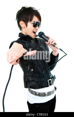 Asian rock singer in performance, isolated on white, focus on fingers. Stock Photo