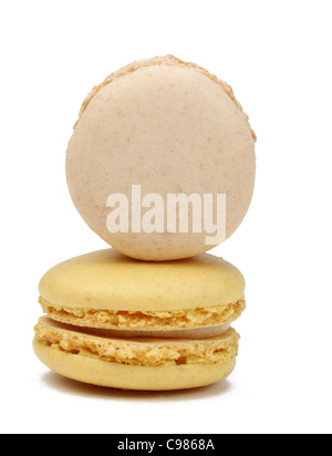 Two French macaroons isolated against a white background.Useful copyspace for your text on the vertical macaroon. Stock Photo