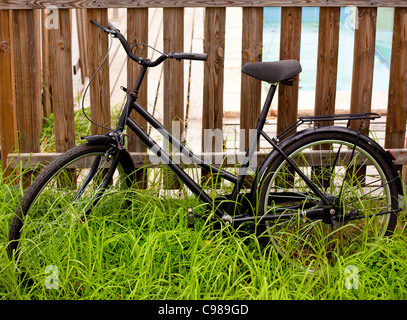 vintage bicycle in fence vintage bicycle in fence