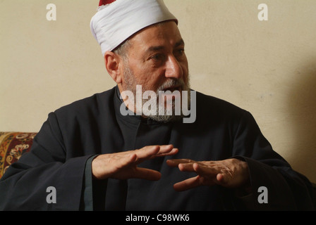 The head of the Mosque of Al Azhar, Sheikh Id Abdul Hamid Abdul Yussuf, in his office inside the Al Azhar Mosque. Stock Photo