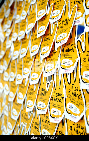 Simpson Bay, St. Maarten, Nov 14, 2011 - McHappy Day 'Give a Hand' paper hands posted on the wall in local McDonald's Restaurant Stock Photo