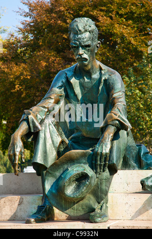 Budapest, Statue of poet Jozsef Attila next to Hungarian Parliament Building in Budapest Stock Photo