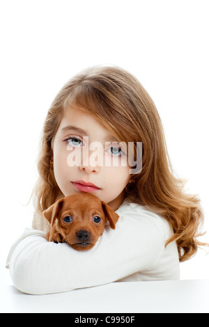 Brunette kid girl with puppy dog mascot mini pinscher on white ...