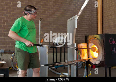 Glass blower giving a demonstration in the Hot Shop at the Franklin Park Conservatory in Columbus, Ohio. Stock Photo