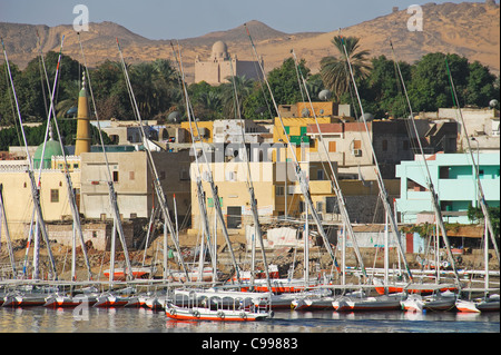 ASWAN, EGYPT. A view of Elephantine Island, with feluccas moored along the banks of the River Nile. 2009. Stock Photo