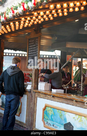 Stall serving food in Victoria Square at the Birmingham German Market.Taken on the opening day 17th November 2011. Stock Photo