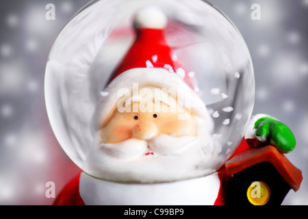 Santa Claus in the snow globe, closeup on Christmas ornament, decorative toy Stock Photo